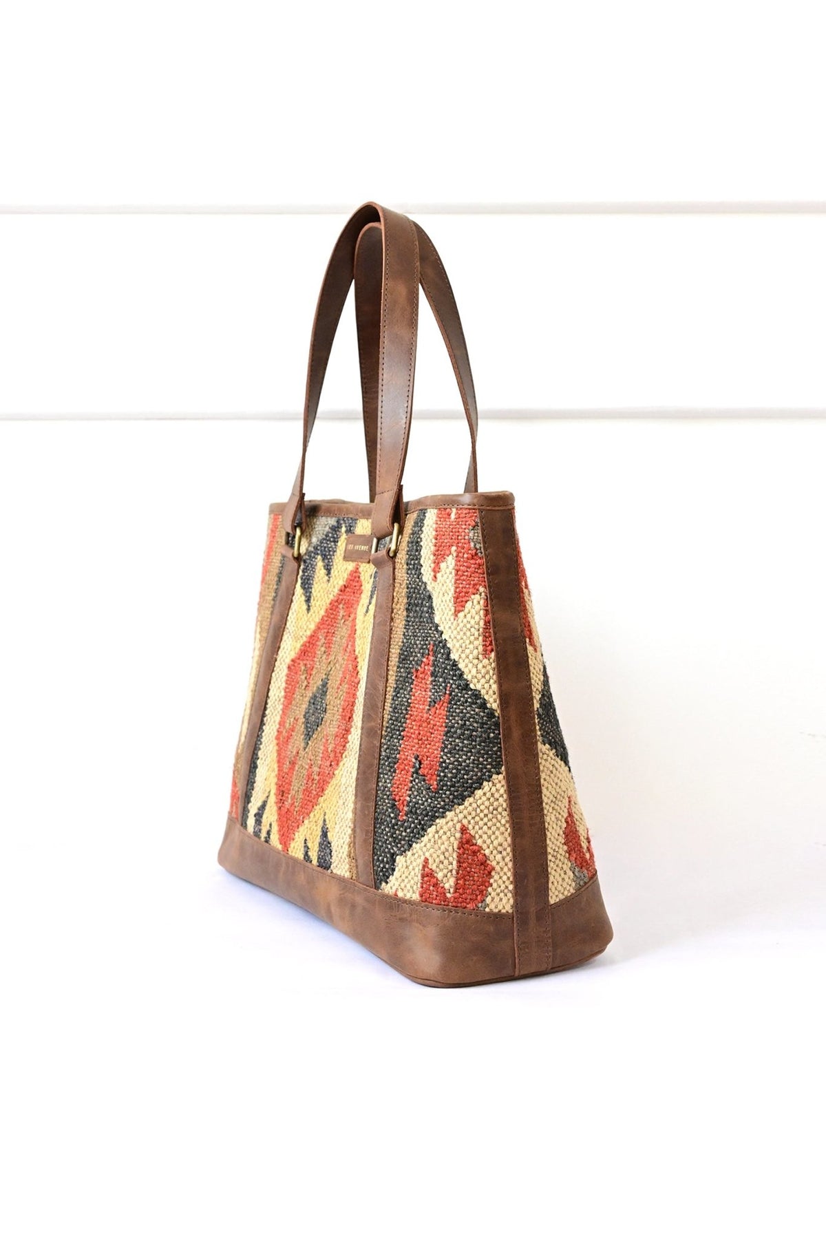 Nymph kilim and leather handbag, side view — Art Avenue
