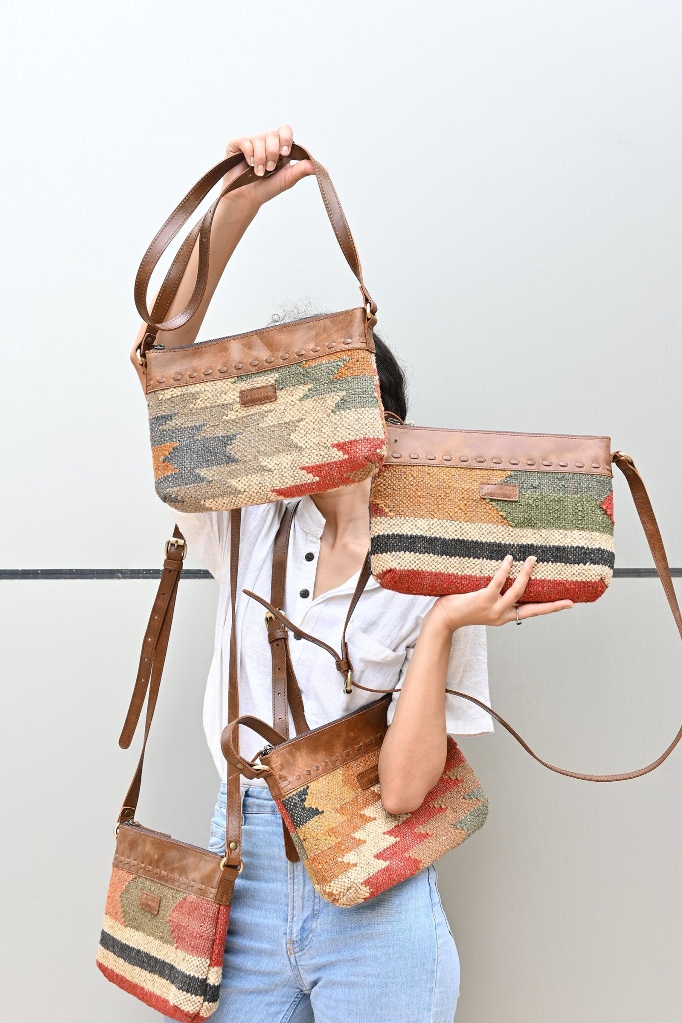 Aribo sling bag on model — Art Avenue