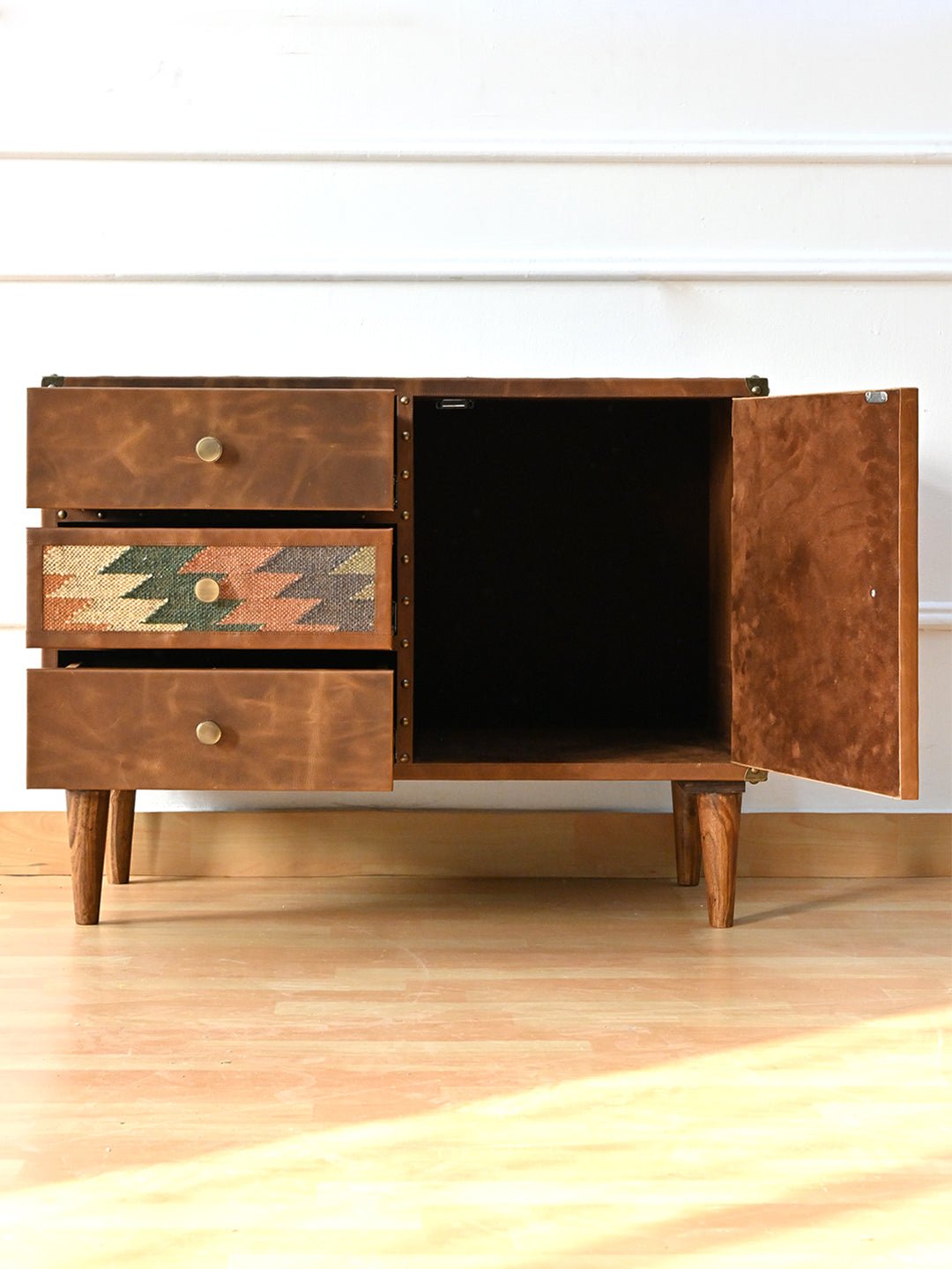Side view of kilim and leather chest of drawers — Art Avenue