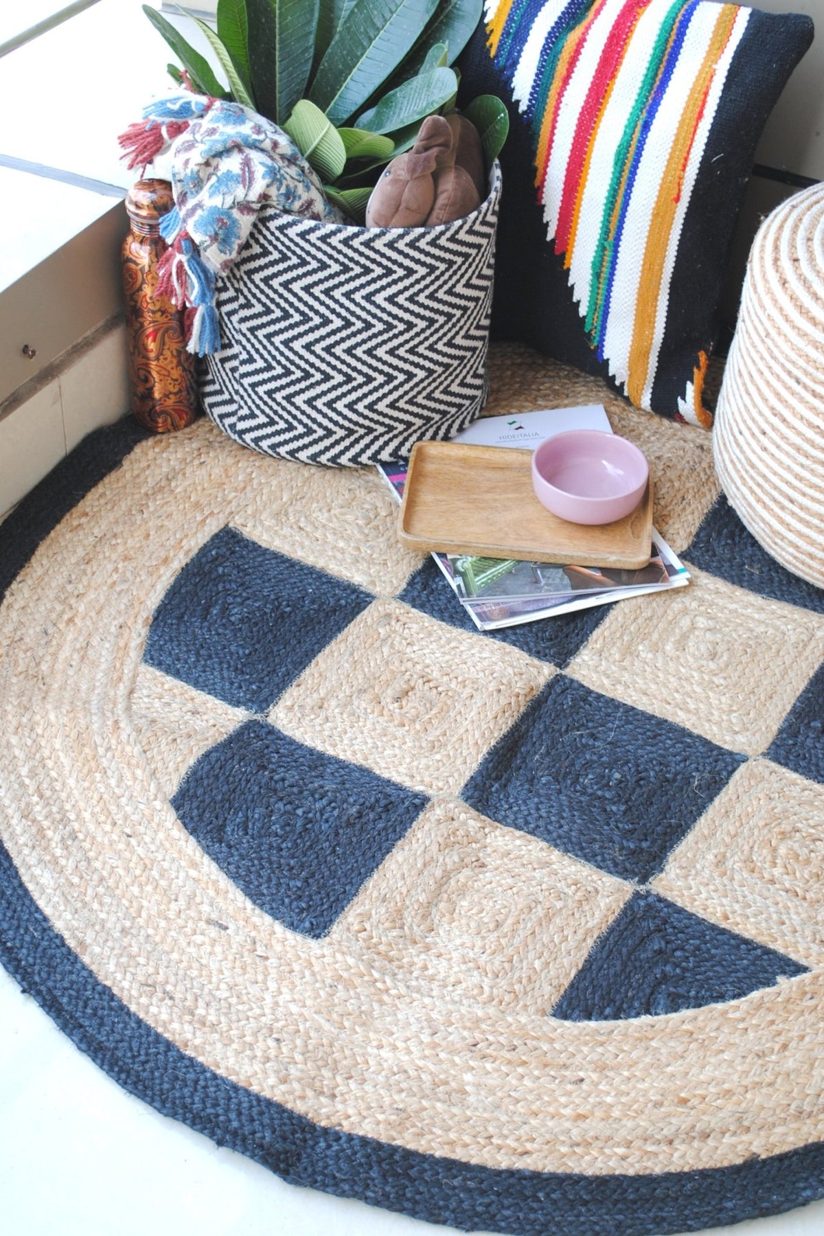 Black and beige checkered round jute rug — hand-braided in Jaipur