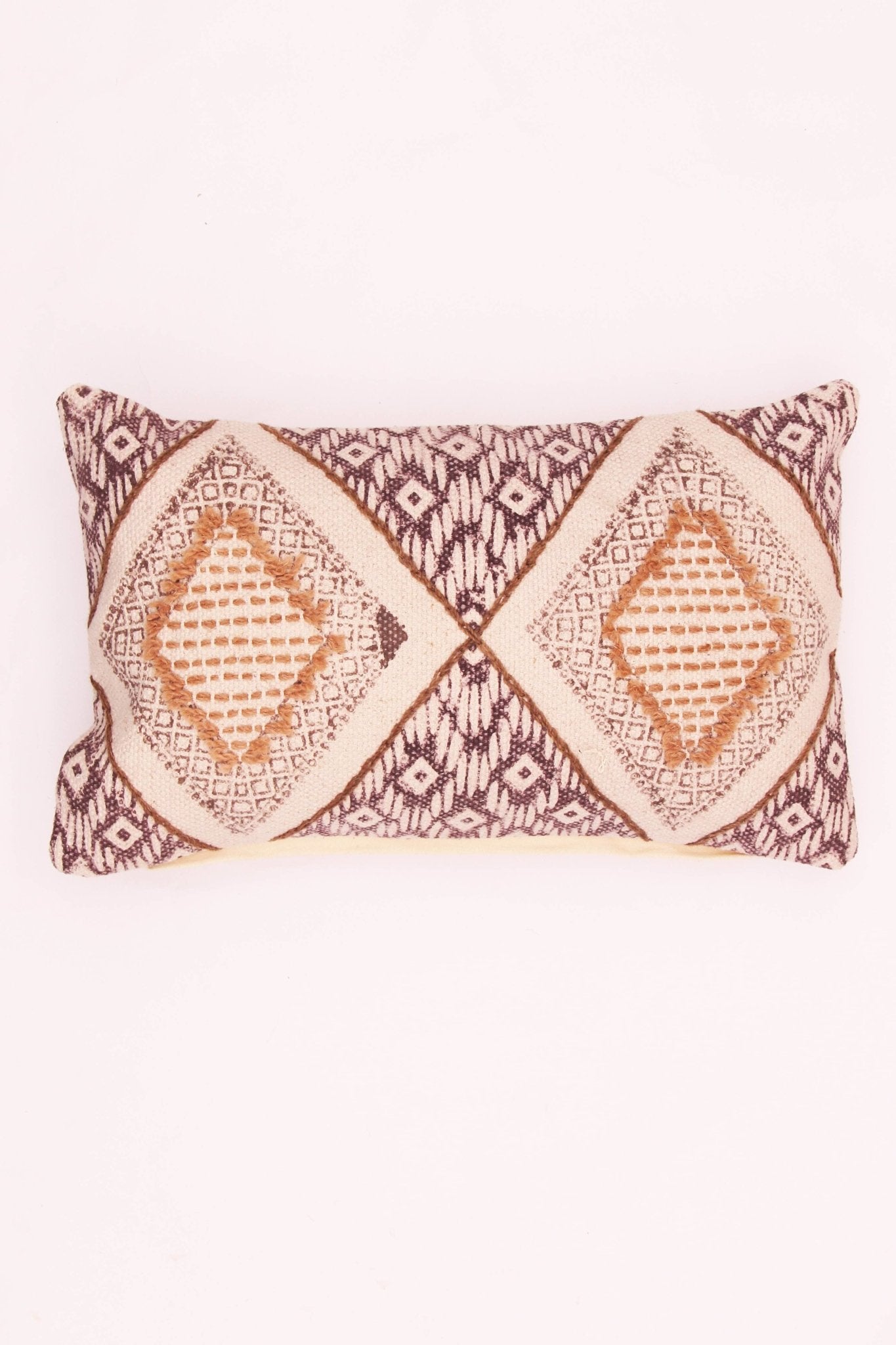 Block-printed embroidered lumbar cushion on sofa — Art Avenue