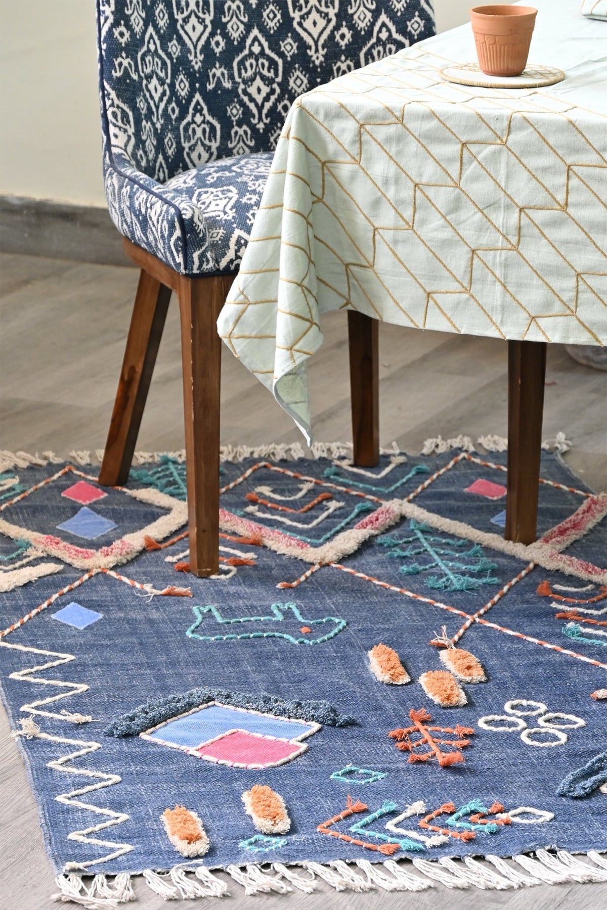 Nicobar hand-embroidered rug — handmade in Jaipur