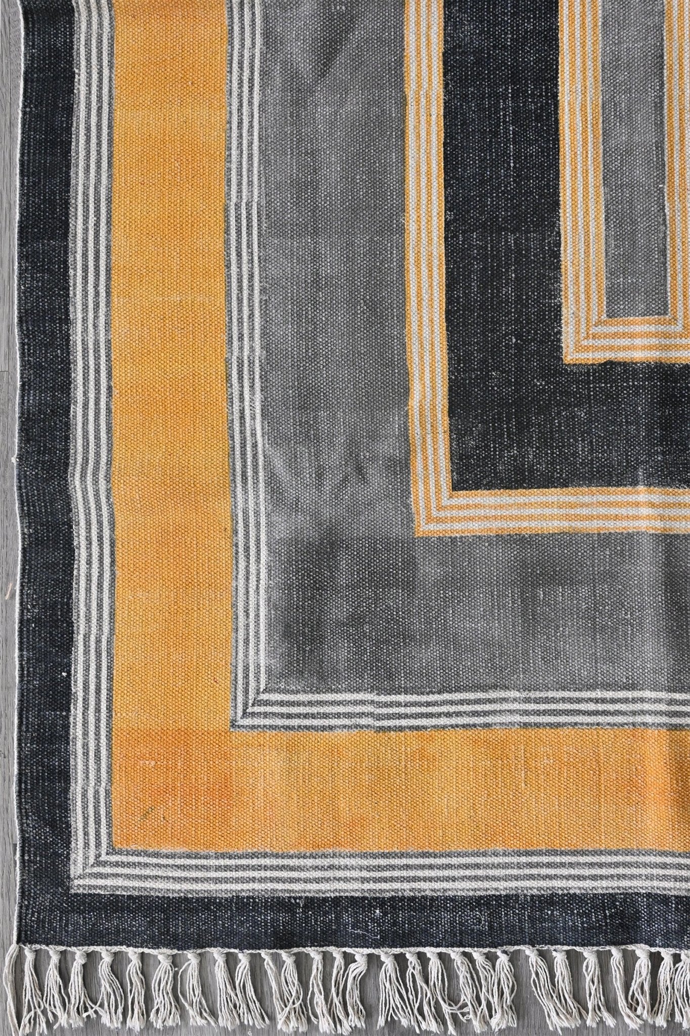 Detail of block-print on grey and yellow dhurrie rug — Art Avenue