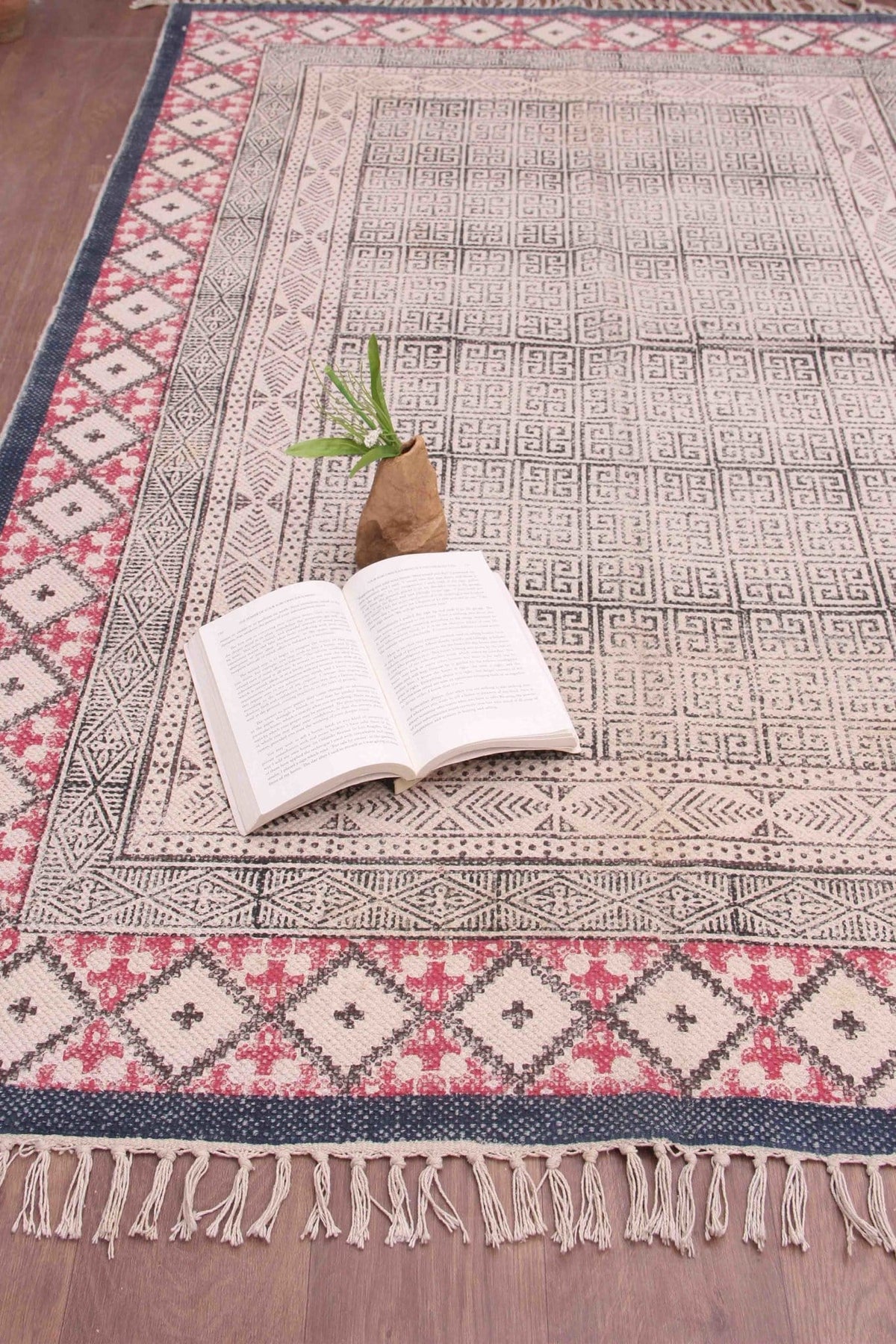 Detail of block-print on black dhurrie rug — Art Avenue